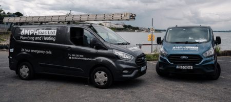 Two branded MPH Gas Ltd vans outside work site