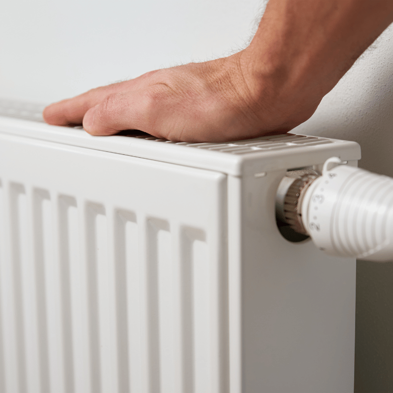 Hand adjusting radiator temperature knob